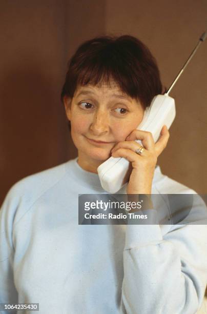 Actress Janine Duvitski speaking into a telephone in a scene from the Christmas special episode 'Starbound' of the BBC Television sitcom 'One Foot in...