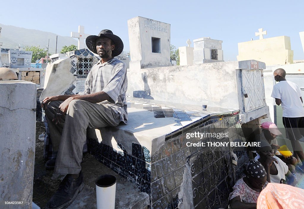 Haitians pay homage at the grave of a re