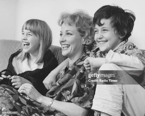 Portrait of actress Sylvia Syms and her two children, November 1971.