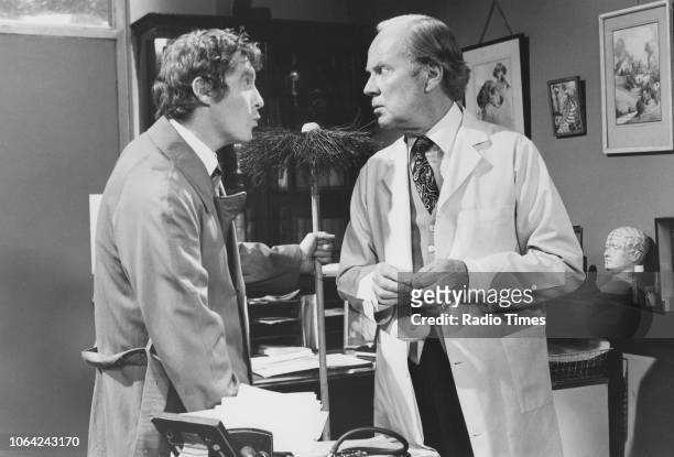 Actors Michael Crawford and Derek Farr in a scene from episode 'King of the Road', or 'Demon King', of the television sitcom 'Some Mothers Do 'Ave...