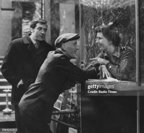 Actors Harry H Corbett, Wilfrid Brambell and Damaris Hayman in a cinema scene from episode 'Sunday for Seven Days' of the television sitcom 'Steptoe...