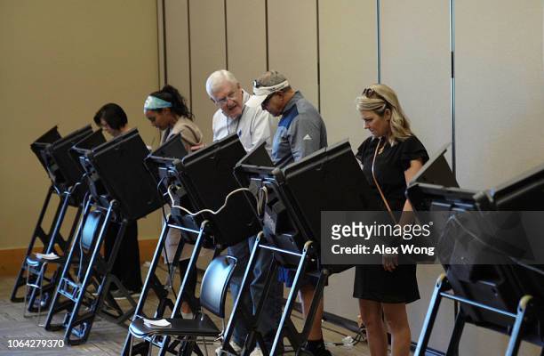 Voters cast their ballots at a polling station at the John P. Holt Brentwood Library on Election Day November 6, 2018 in Brentwood, Tennessee....