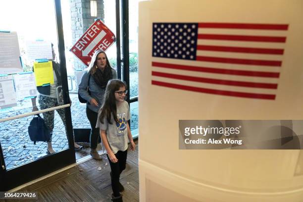 Voters enter a polling station at the John P. Holt Brentwood Library to cast their votes on Election Day November 6, 2018 in Brentwood, Tennessee....