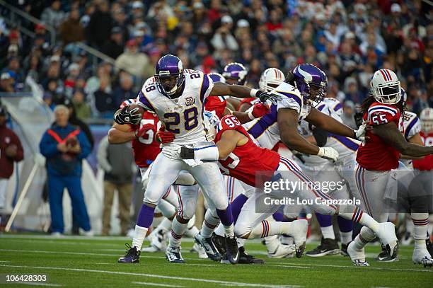 Minnesota Vikings Adrian Peterson in action, rushing vs New England Patriots. Foxborough, MA CREDIT: Lou Capozzola