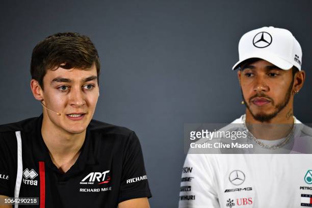 Grand Prix Formula 2 driver George Russell of Great Britain and Williams F1 and Lewis Hamilton of Great Britain and Mercedes GP talk in the Drivers...