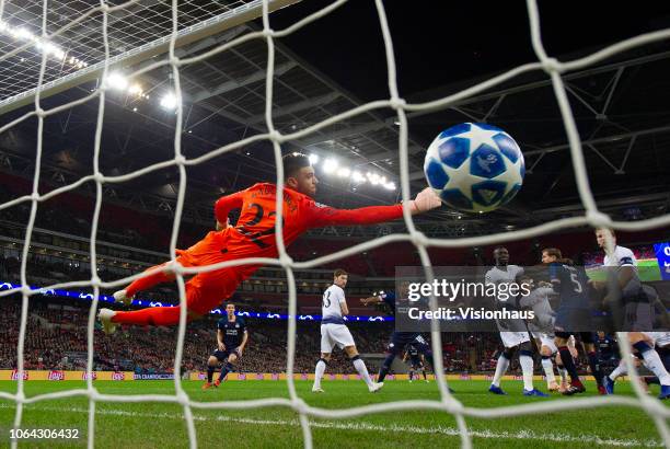 Paulo Gazzaniga of Tottenham Hotspur dives but fails to stop a header from PSV Eindhoven striker Luuk de Jong during the Group B match of the UEFA...