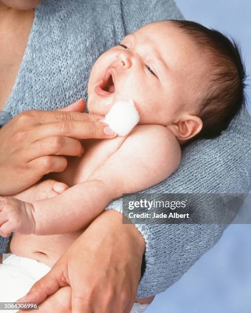 baby with cotton ball - cotton ball stock-fotos und bilder