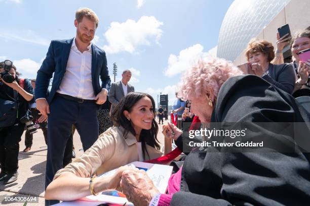 Prince Harry, Duke of Sussex and Meghan, Duchess of Sussex greet Daphne Dunne at Sydney Opera House on October 16, 2018 in Sydney, Australia. The...