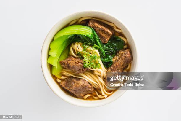 beef noodle soup with chinese broccoli on a white background - asiatische küche stock-fotos und bilder