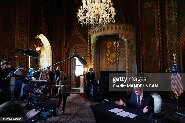 President Donald Trump speaks to the press after talking to members of the military via teleconference from his Mar-a-Lago resort in Palm Beach,...