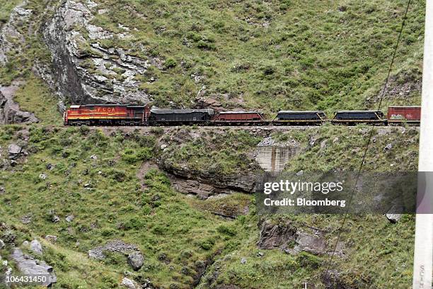 Ferrocarril Central Andino train carrying minerals cuts across the side of a mountain in Morococha, Peru, on Monday, April 5, 2010. Henry Meiggs,...