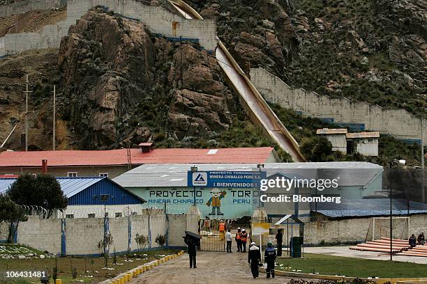 Workers walk near the entrance to Chinalco's temporary base of mining operations at the Toromocho Project in Morococha, Peru, on Monday, April 5,...