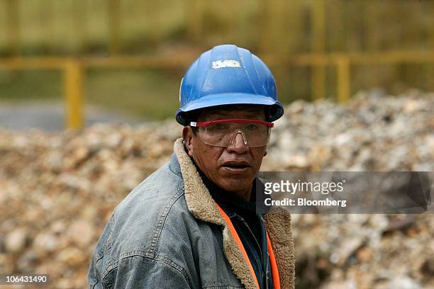Man pauses during work at Chinalco's temporary base of mining operations at the Toromocho Project in Morococha, Peru, on Monday, April 5, 2010....