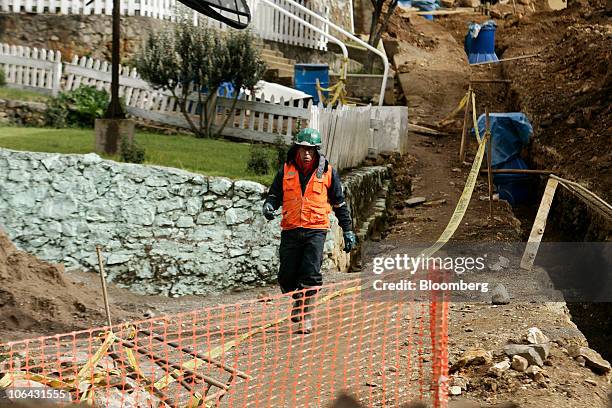 Worker walks down a path toward Chinalco's temporary base of mining operations at the Toromocho Project in Morococha, Peru, on Monday, April 5, 2010....