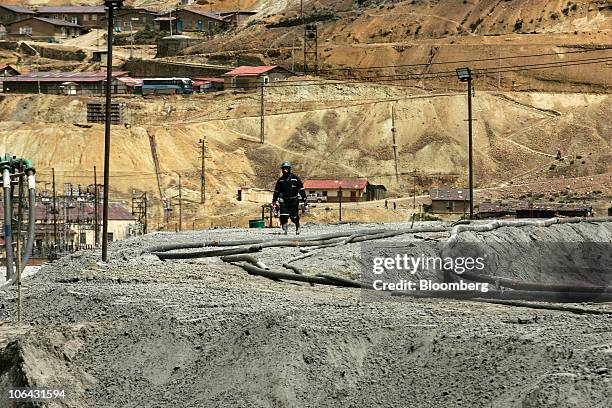 Miner walks near Morococha, Peru, on Monday, April 5, 2010. Aluminum Corp. Of China, known as Chinalco, a Chinese state-owned mining company, is...