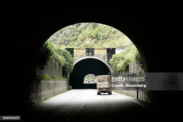 Truck travels in between two tunnels along the Carretera Central, an 88-mile route between the Port of Callao and the mining town of Morococha, Peru,...