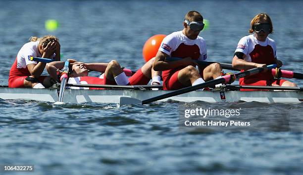 Barbara Grocholska, Tomasz Kwiatkowski, Piotr Blazejczyk and Anna Rudnicka of Poland show their disappointment after losing control of their boat...