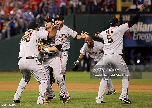 Pablo Sandoval, Freddy Sanchez, Cody Ross, Edgar Renteria and Juan Uribe of the San Francisco Giants celebrate after they won 3-1 against the Texas...