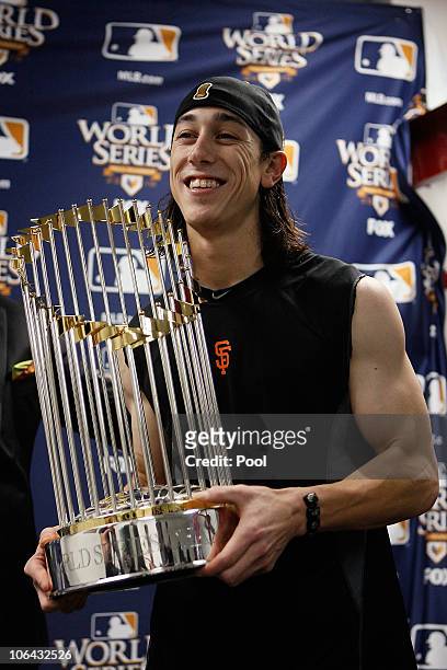 Tim Lincecum of the San Francisco Giants celebrates with the World Series trophy in the locker room after the Giants won 3-1 against the Texas...