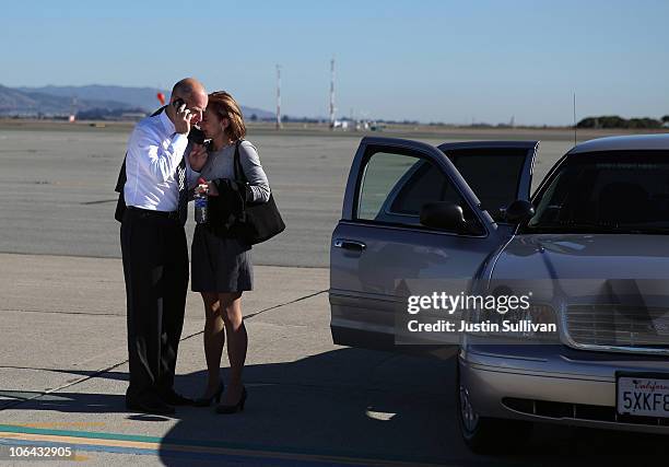 California attorney General and democratic gubernatorial candidate Jerry Brown embraces his wife Anne Gust-Brown while talking on his phone at the...