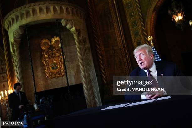 President Donald Trump speaks to the press after talking to military members via teleconference from his Mar-a-Lago resort in Palm Beach, Florida on...