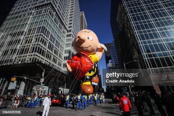 The Charlie Brown balloon floats above the crowd during the Macy's Thanksgiving Day Parade on November 22, 2018 in New York City, United States.