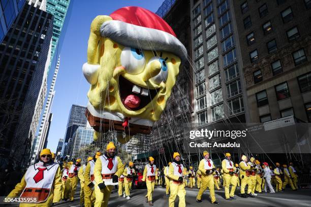 Sponge Bob balloon floats above the crowd during the Macy's Thanksgiving Day Parade on November 22, 2018 in New York City, United States.