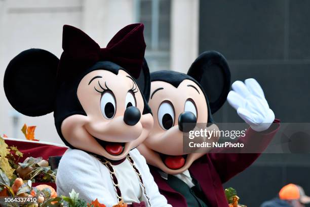 Disney's Mini and Mickey Mouse ride on a Walt Disney World carriage during the 99th 6ABC/Dunkin' Donuts Annual Thanksgiving Day parade, in...