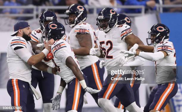 Quarterback Chase Daniel of the Chicago Bears celebrates with Eddie Jackson of the Chicago Bears who scored a touchdown after he ran back a Matthew...