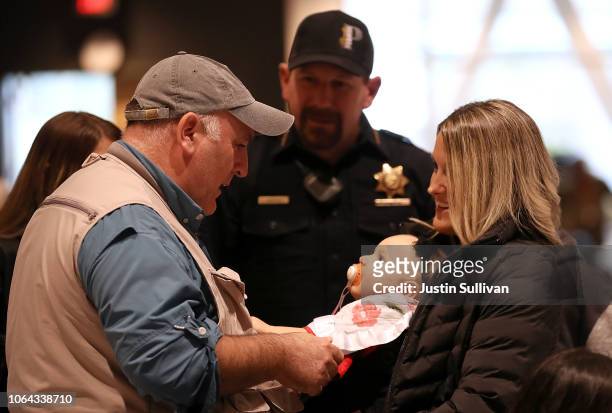 Celebrity chef Jose Andres talks with Paradise police chief Eric Reinbold, his wife Logan Reinbold and doughter Hayden during a community...