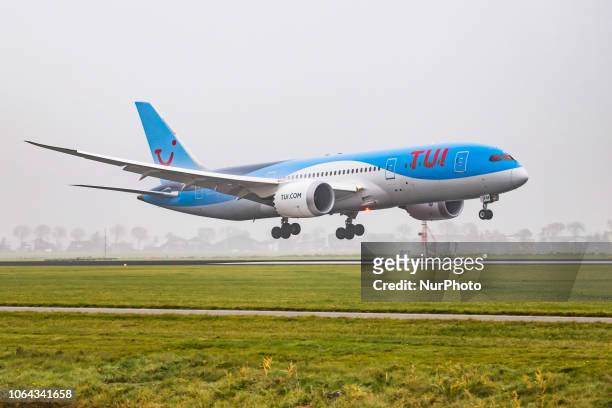 Airlines Netherlands Boeing 787-8 Dreamliner landing in the mist in Amsterdam Schiphol International Airport. The aircraft registration is PH-TFM....
