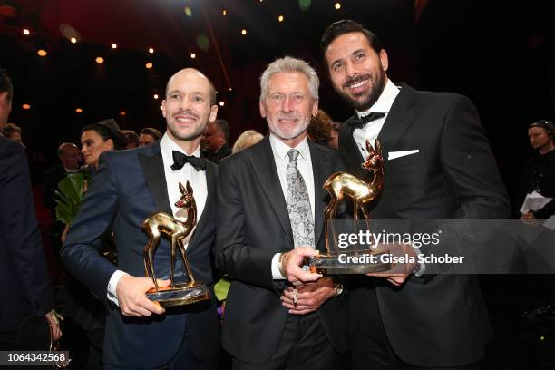 Iron man winner Patrick Lange, Paul Breitner, Claudia Pizarro with award during the Bambi Awards 2018 final applause at Stage Theater on November 16,...