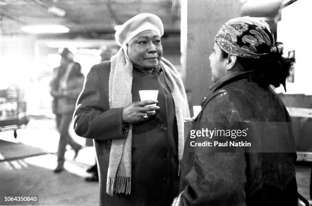 Actress Esther Rolle , left, on the film set for 'The Kid Who Loved Christmas' at Union Station, speaks with a member of the production team in...