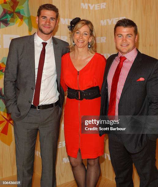 Liam Hemsworth, his mother Leonie Hemsworth and brother Liam Hemsworth attend the Myer marquee during Emirates Melbourne Cup Day at Flemington...