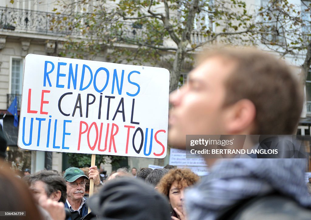A man holds a placard reading "Make the