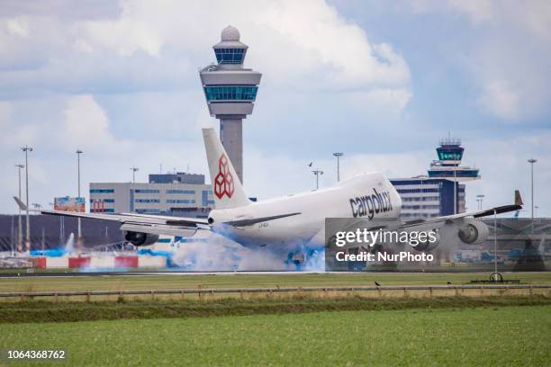 Cargolux Airlines International Boeing 747-4HQF landing in Amsterdam Schiphol International Airport in The Netherlands. The airplane's registration...