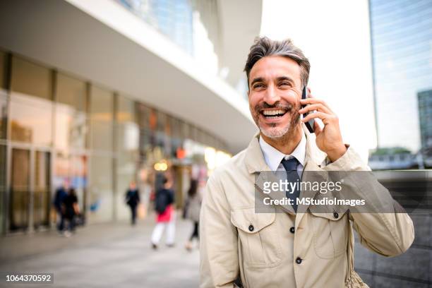 mature businessman on the phone. - italy smile stock pictures, royalty-free photos & images