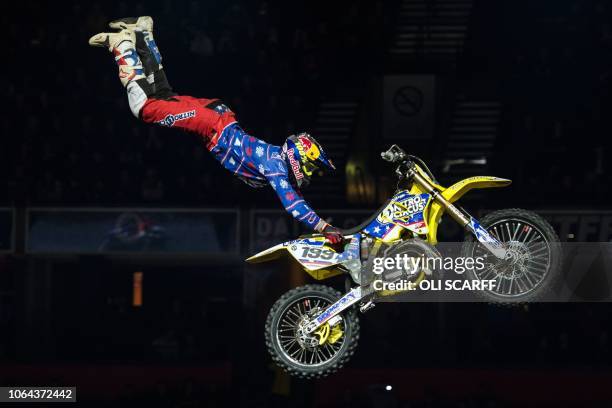 Freestyle motocross riders perform stunts in Manchester Arena during Nitro Circus' You Got This Tour in Manchester, northern England on November 22,...