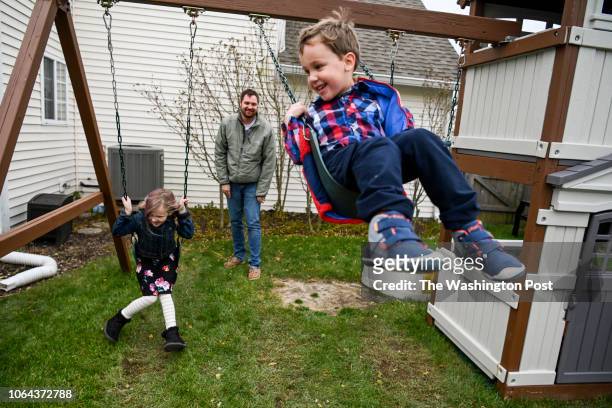 Matthew White plays with his children Molly White and Logan White at the White family's house in Carmel, Indiana on November 12, 2018. Matthew...