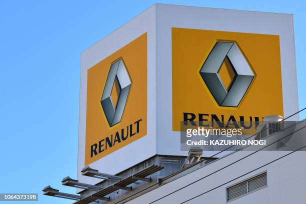 The logo of Renault SA is seen outside a dealership in Tokyo on November 23, 2018. - Nissan's board sacked Carlos Ghosn as chairman on November 22, a...