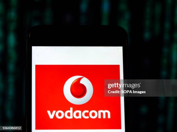 In this photo illustration, the Vodacom Mobile operator company logo seen displayed on a smartphone.