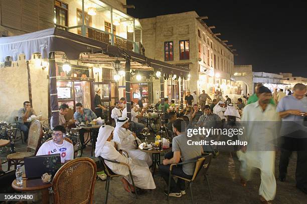 Tourists, expats and locals mix in the Souq Waqif on October 25, 2010 in Doha, Qatar. The Souq Waqif, with its myriad of little streets containing...