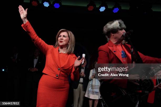 Senate candidate for Tennessee Rep. Marsha Blackburn celebrates as country singer John Rich performs during an election night party November 6, 2018...