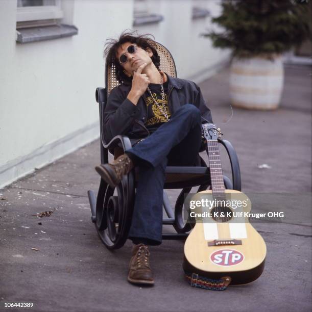 David Peel poses for a portrait with his acoustic guitar, circa 1968 in Germany.