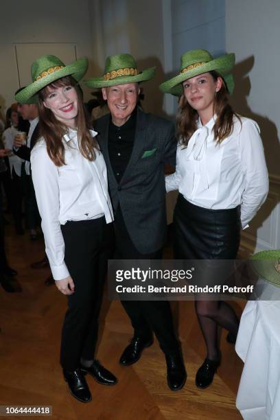 Stephen Jones, hat designer for Christian Dior fashion house, poses with Catherinettes during Dior celebrates Sainte Catherine Celebration at Dior...