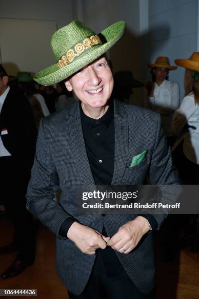 Stephen Jones, hat designer for Christian Dior fashion house, poses during Dior celebrates Sainte Catherine Celebration at Dior Boutique on November...