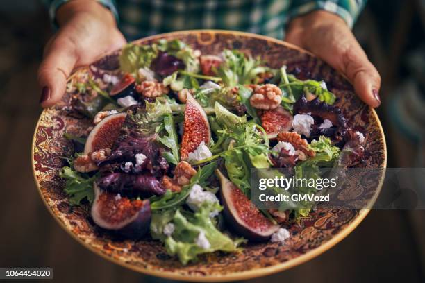 arugula fig salad with walnuts and feta cheese - greek food stock pictures, royalty-free photos & images