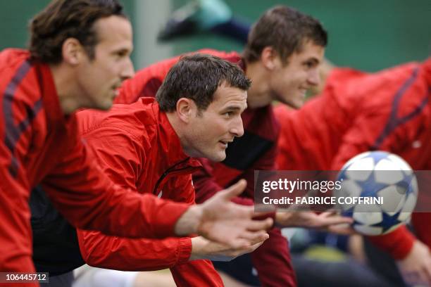 Basel's forward Marco Streller forward Alex Frei and midfielder Pascal Schuerpf train on the eve of their group E Champions League football match FC...