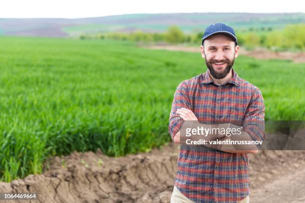 farmer standing with arms crossed - farmer arms crossed stock pictures, royalty-free photos & images
