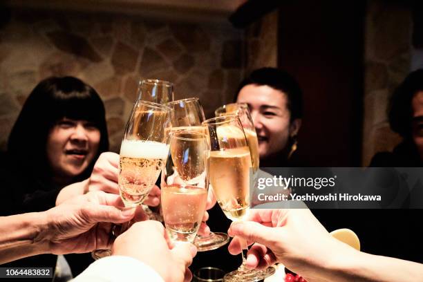 toast ! birthday party with champagne - asian family cafe stockfoto's en -beelden